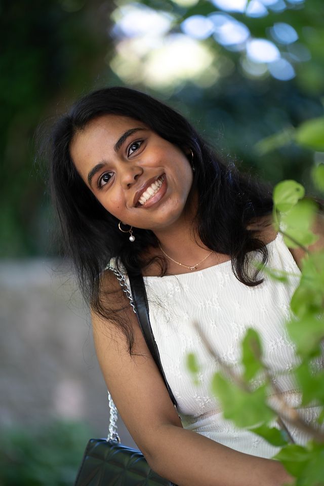 Smiling woman photographed outdoors