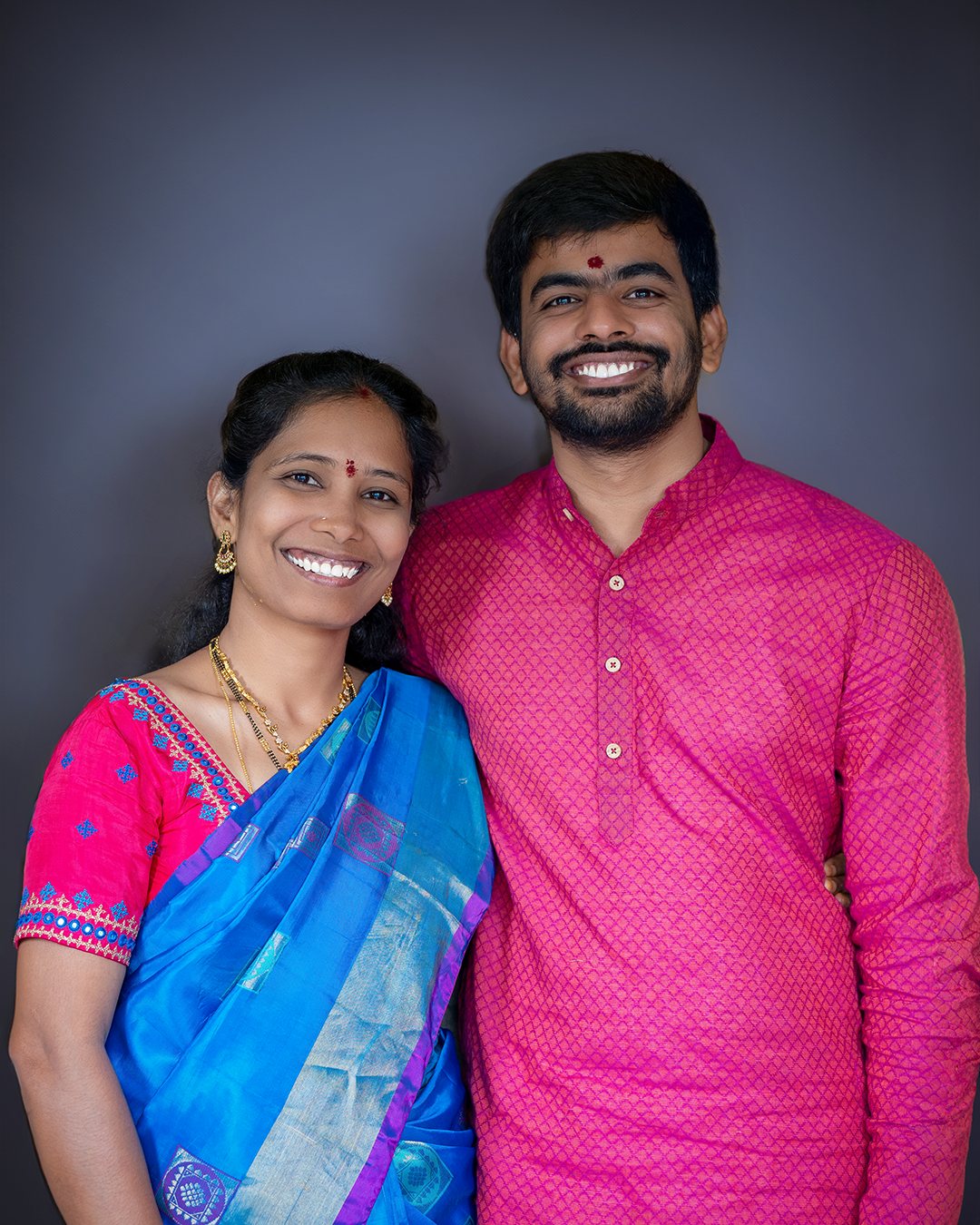 Couple studio portrait, traditional wear