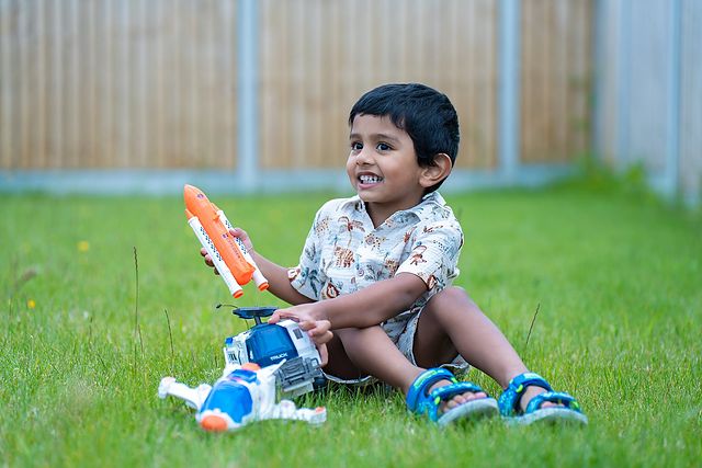 Toddler playing on the grass