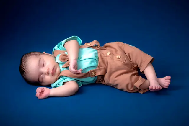 Newborn baby boy studio pose