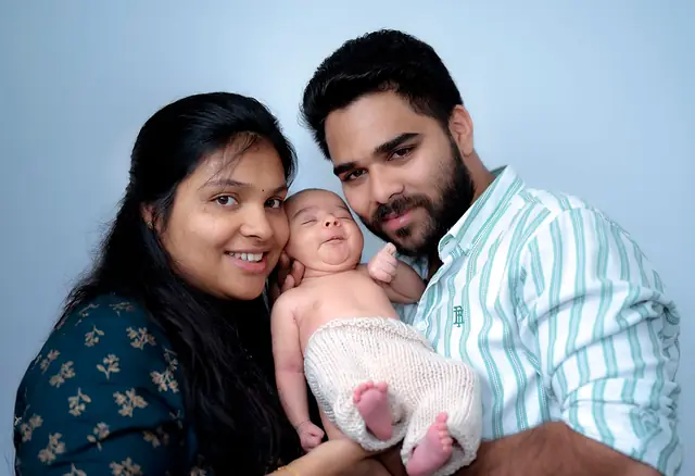 Parents holding their newborn