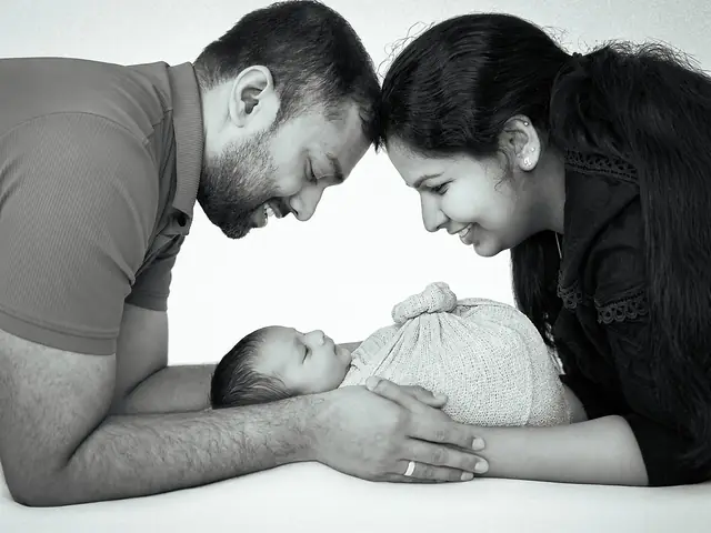 Parents with newborn, black and white