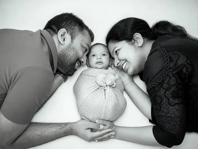 Parents with newborn, monochrome